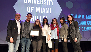 UM Hillel Staff and Students Accept Award on Stage